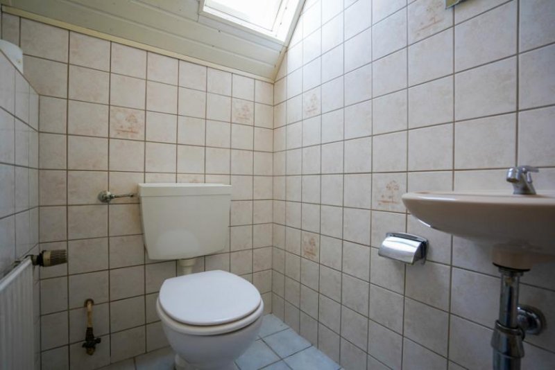 Rhauderfehn Kapitalanlage mit Potenzial: Dreiparteienhaus in gefragter Lage von Holte! Haus kaufen