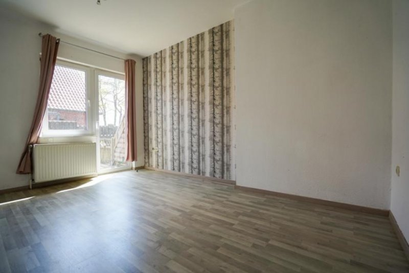 Rhauderfehn Kapitalanlage mit Potenzial: Dreiparteienhaus in gefragter Lage von Holte! Haus kaufen