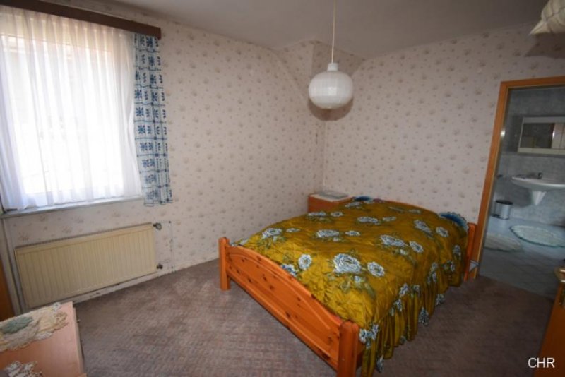 Walkenried Freistehendes Einfamilienhaus mit kleinem Nebengelass, Garage und ebenerdigen Grundstück Haus kaufen