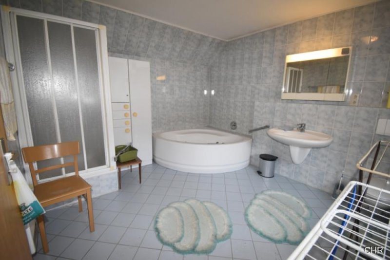 Walkenried Freistehendes Einfamilienhaus mit kleinem Nebengelass, Garage und ebenerdigen Grundstück Haus kaufen