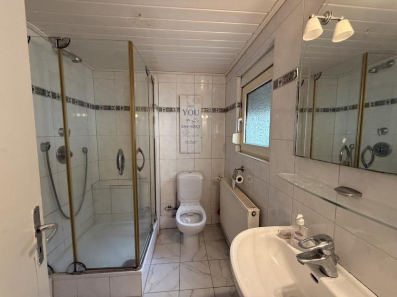 Düren Kleines Einfamilienhaus mit Garten, Garage und Zusatzflächen in guter Lage von Düren-Birgel Haus kaufen