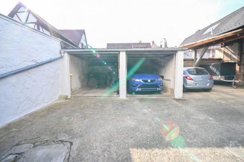 Großostheim DIETZ: Vermietetes (362qm) Wohn- & Geschäftshaus: 4 Wohneinheiten, 2 Ladenlokale & Gewölbekeller! Haus kaufen