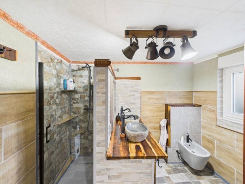 Merchweiler Einfamilienhaus in Merchweiler – modernisiert 2024, 102 m² Wohnfläche und großer Garten! Haus kaufen