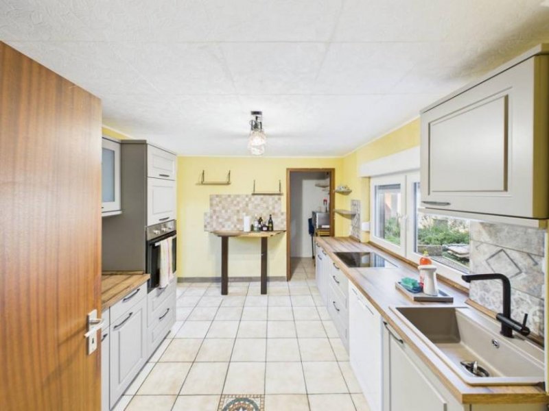 Merchweiler Einfamilienhaus in Merchweiler – modernisiert 2024, 102 m² Wohnfläche und großer Garten! Haus kaufen