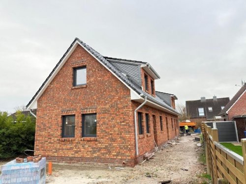 Esens Immobilien Esens - ruhige Innenstadt-Lage: Neubau Ferienwohnung im Erdgeschoss mit Terrasse Wohnung kaufen