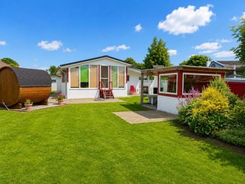 Südbrookmerland Immobilien Möbliertes Ferienhaus mit Boot und Fass-Sauna am Wasser! Haus kaufen