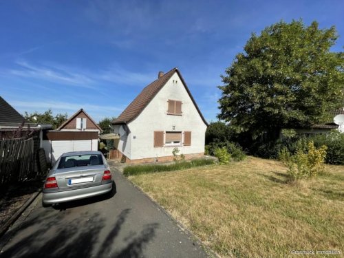 Büdingen Immo Über den Dächern von Büdingen - Schönes Siedlerhaus mit großem Grundstück zu verkaufen Haus kaufen