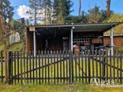 Groß Lindow Erholung pur: Freizeitbungalow mit Holzblockhaus in Bungalowsiedlung und Kanalblick Haus kaufen