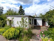 Melchow Sonniges Baugrundstück mit Ferienhaus und Garage - direkte Waldrandlage in Melchow Grundstück kaufen