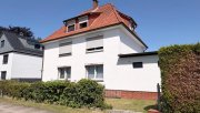 Hamburg HAMBURGER DREIFAMILIENHAUS MIT 12 GARAGEN, LAUFENDEN MIETEINNAHMEN UND ENTWICKLUNGSPOTENZIAL! Haus kaufen