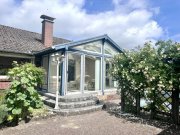 Lohe-Rickelshof Wohnen auf einer Ebene in Lohe-Rickelshof: Bungalow mit Einliegerwohnung und Wintergarten Haus kaufen