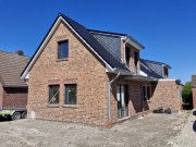 Esens Esens - ruhige Innenstadt-Lage: Neubau Ferienwohnung im Obergeschoss mit Balkon Wohnung kaufen