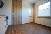 Rhauderfehn Kapitalanlage mit Potenzial: Dreiparteienhaus in gefragter Lage von Holte! Haus kaufen
