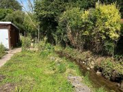 Eschweiler SANREALTY | Doppelhaushälfte mit zwei Garagen, Garten und Bachlauf in Eschweiler-Nothberg Haus kaufen