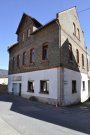 Niedernhausen Niedernhausen-Vermietetes Dreifamilienhaus mit ausbaufähiger Scheune in Königshofener Kernlage! Haus kaufen