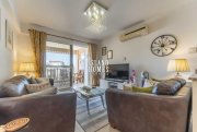 Kapparis 3 bedroom, second floor apartment with TITLE DEEDS on popular complex with two communal swimming pools in great location of -