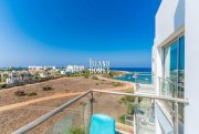 Protaras 1 bedroom, PENTHOUSE apartment with sea views, 2 communal pools and tennis court in SEAFRONT location of Protaras - COR123The of