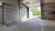 Uelsen Helle Stahlrahmen-Halle mit elektrischem Sektionaltor und großer Hofzufahrt – Industriegebiet Uelsen Gewerbe mieten